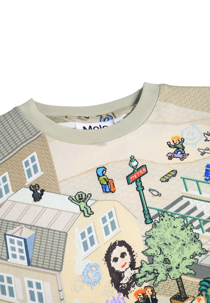 Children's t-shirt with a colorful graphic of a neighborhood scene on a white background.