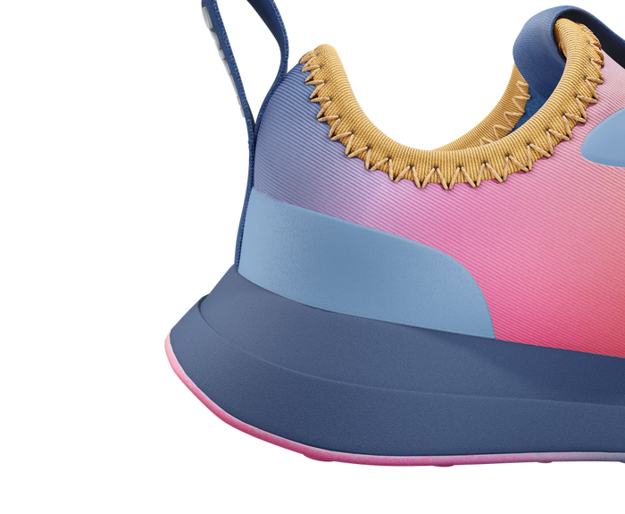 Close-up of a colorful sneaker with pink, blue, and yellow accents on a white background.