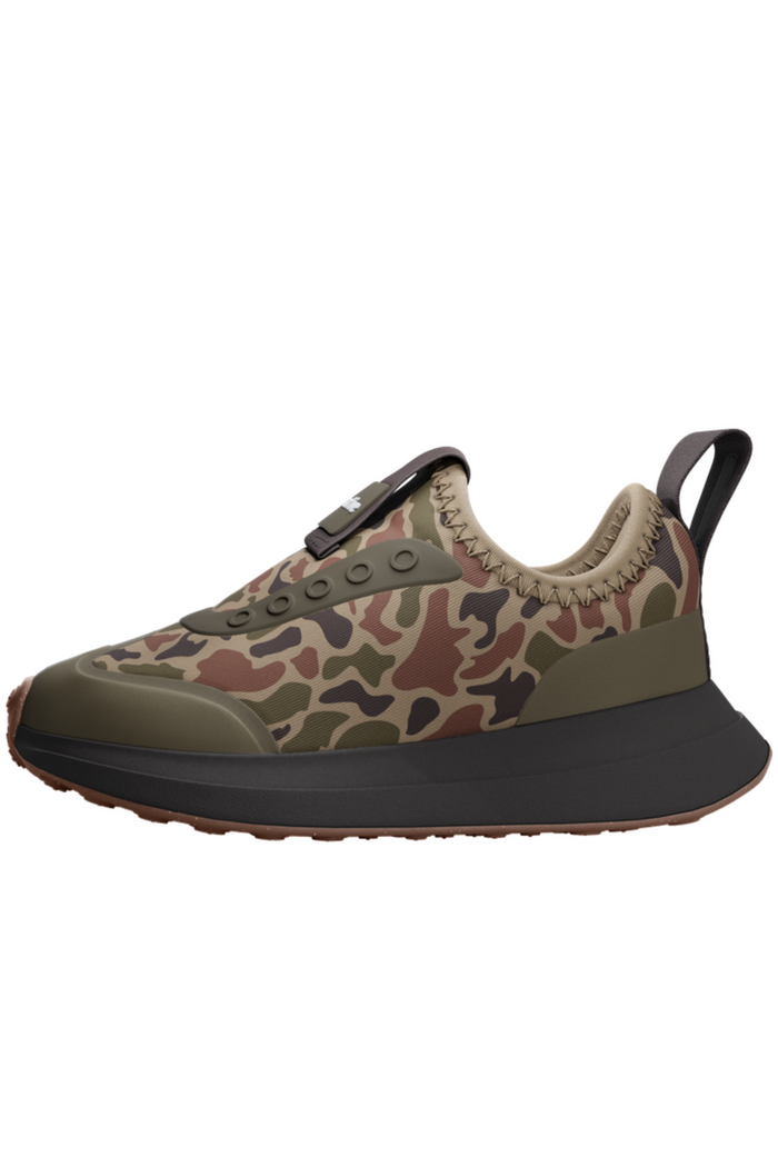 Camouflage sneaker with brown sole on a white background