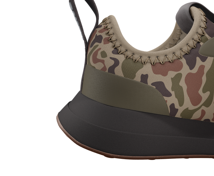 Close-up of a sneaker with camouflage pattern on a white background