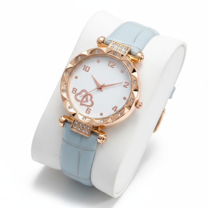 A high-lustre pink solitaire gemstone set in an intricately detailed silver-toned band with pavé-set accents, captured in a clean, high-contrast editorial style.