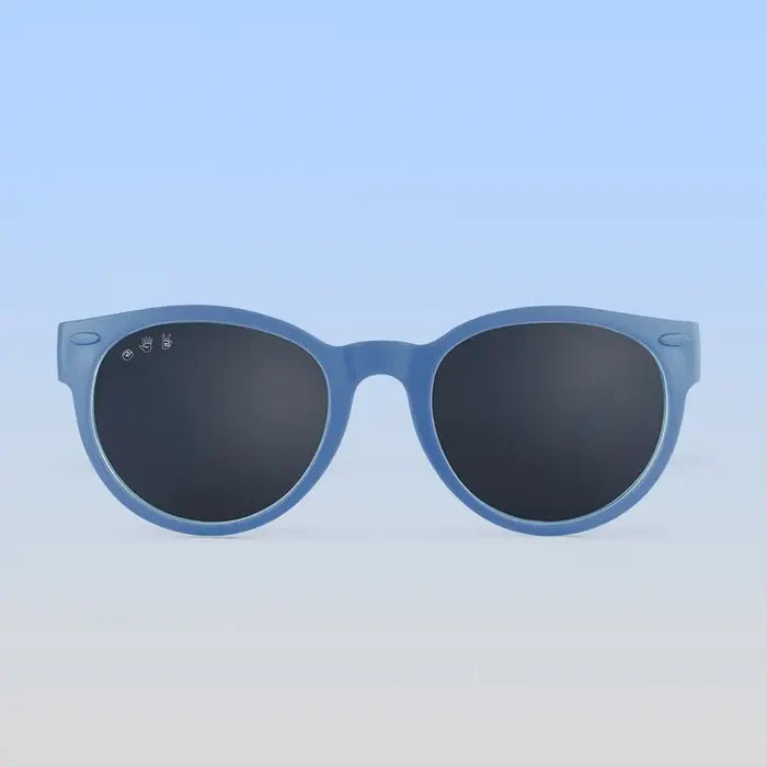 Blue sunglasses with dark lenses on a light blue background