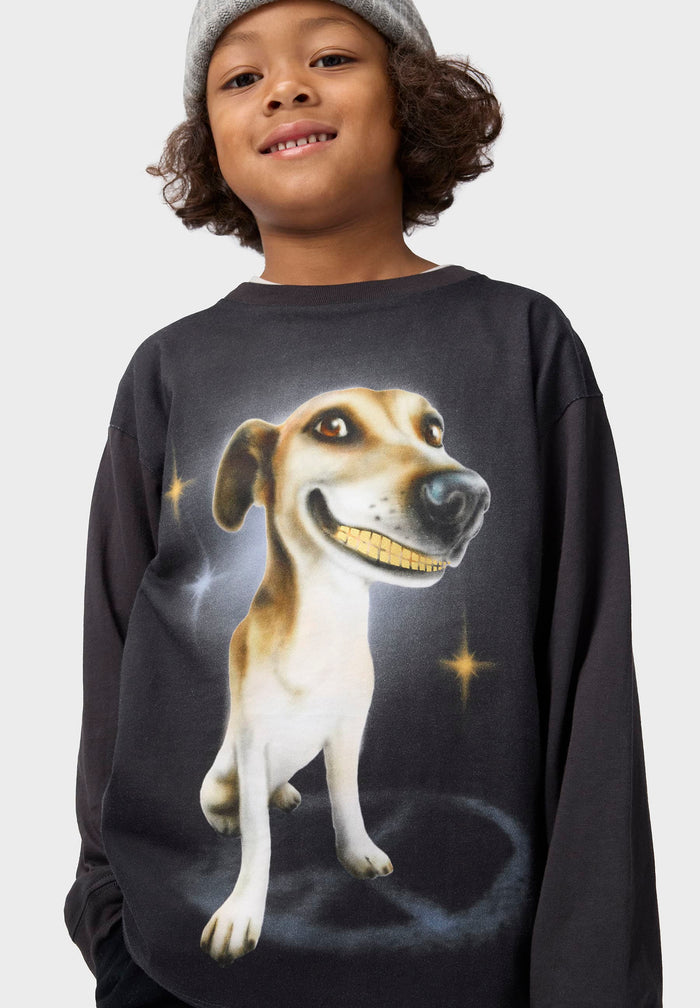 Child wearing a black tee with a dog graphic on a white background