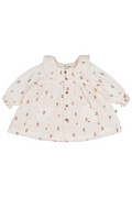 Baby dress with floral pattern on a white background
