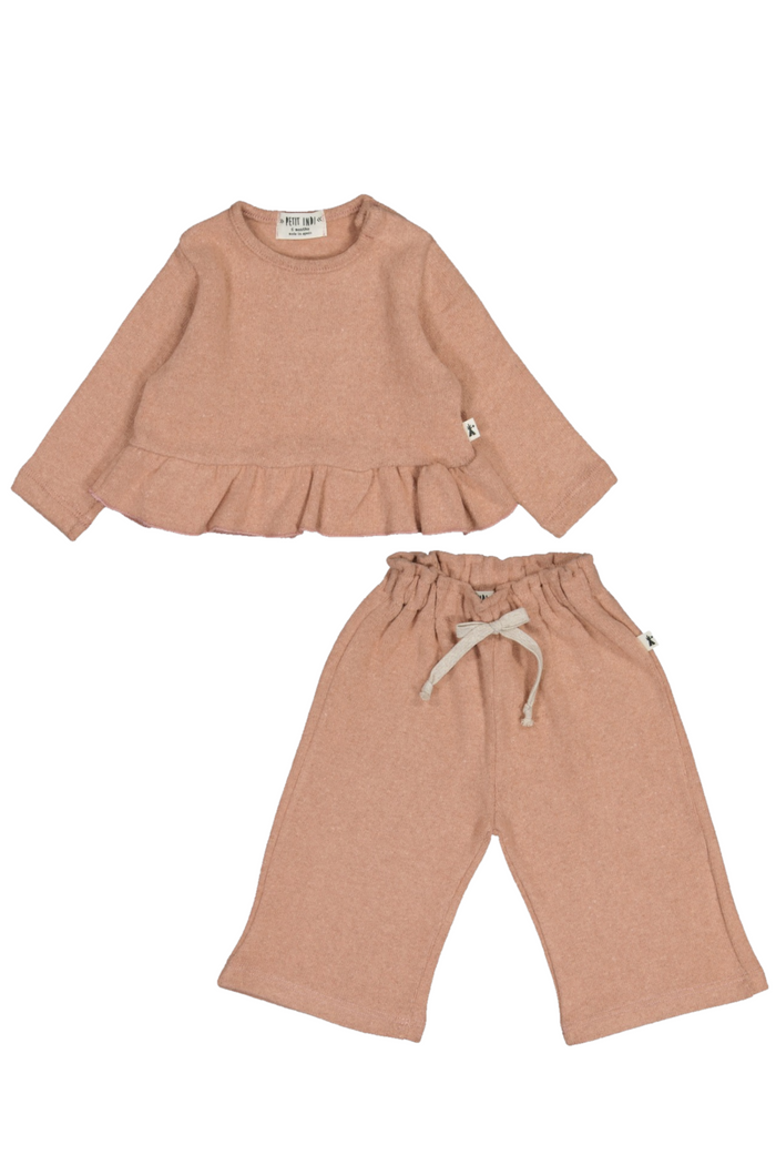 Children's outfit with ruffled top and wide-leg pants on a white background