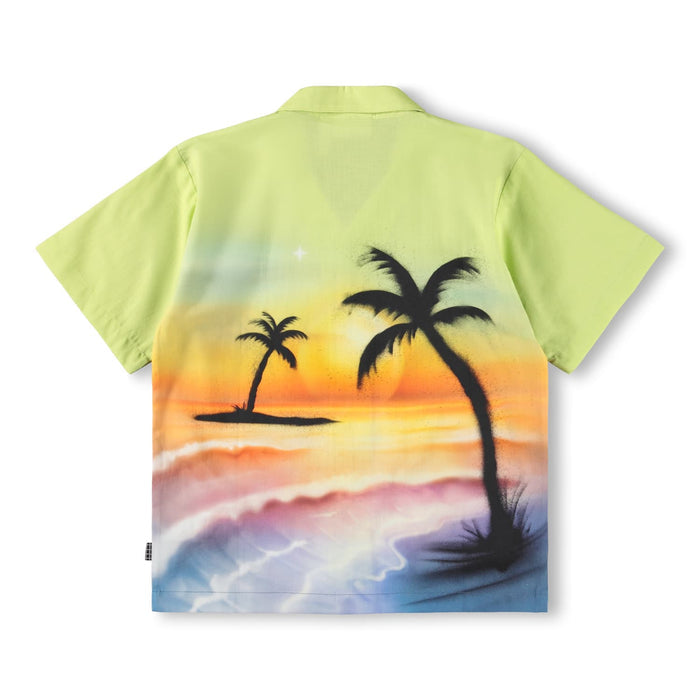 Shirt with a tropical design featuring palm trees and a sunset on a white background