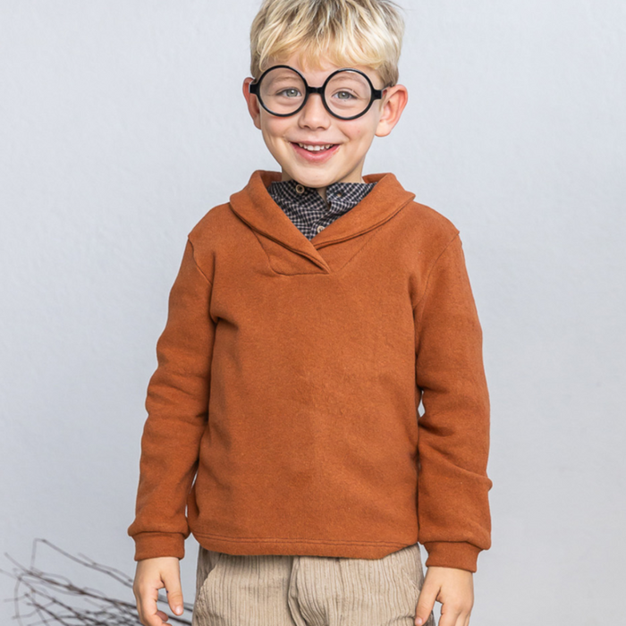 Child wearing shawl collar sweater