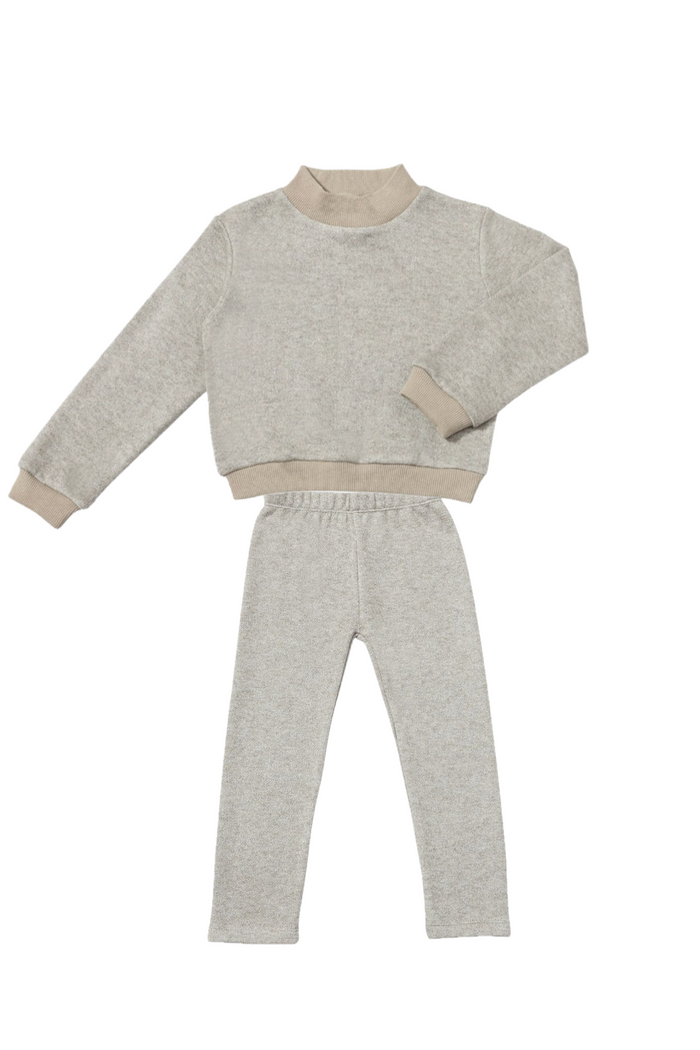 Light gray sweater and pants set on a white background