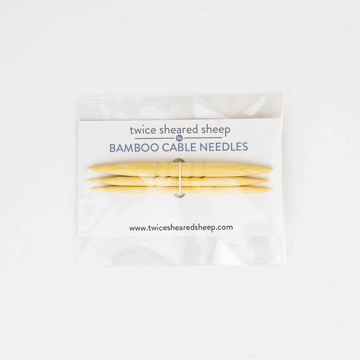 Set of three shortie bamboo cable needles in clear packaging with Twice Sheared Sheep branded header card