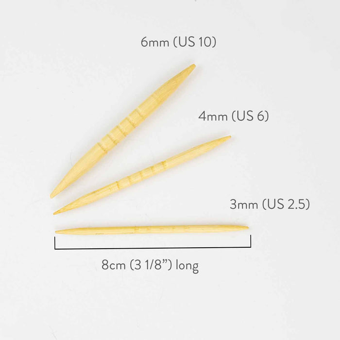 Three shortie bamboo cable needles showing sizes — 6mm (US 10), 4mm (US 6), and 3mm (US 2.5) — each 8cm (3 1/8 inches) long on white background