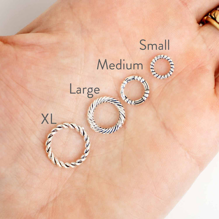 Simple Braided Ring stitch markers on bamboo knitting needles with blue knitting project