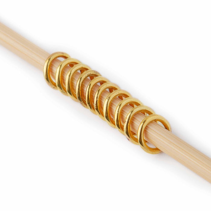Simple Gold Ring stitch markers medium size on knitting needles with knitting showing scale and fit