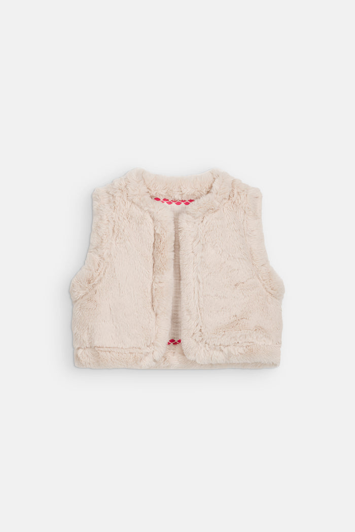 reverse side of faux fur vest with pink ric rac detail at neck and waist on white background.