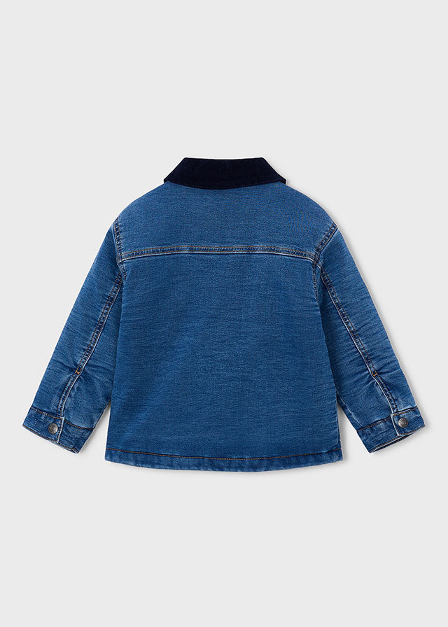 Blue denim jacket with black collar on a light gray background