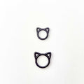 Two black cat stitch markers in small and large sizes shown side by side to compare the two available sizes