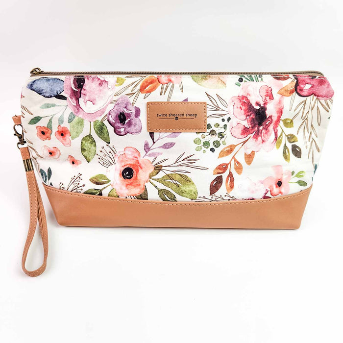 Spring Floral Trinity Bag medium zippered knitting project bag with watercolor rose and peony floral print fabric, tan faux leather bottom, brass zipper, and wrist strap