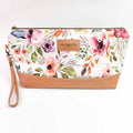 Spring Floral Trinity Bag medium zippered knitting project bag with watercolor rose and peony floral print fabric, tan faux leather bottom, brass zipper, and wrist strap