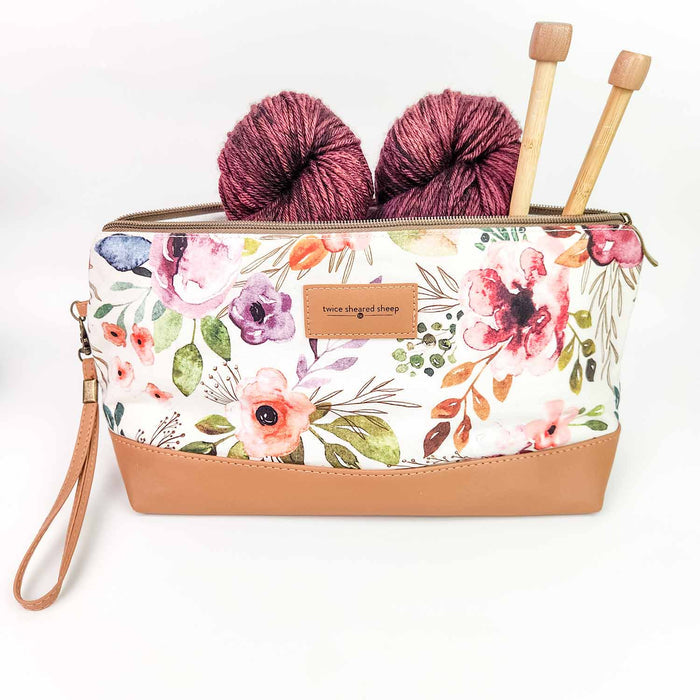 Spring Floral Trinity Bag open showing the large main pouch with cream lining and labeled roomy accessory pocket for needles and scissors