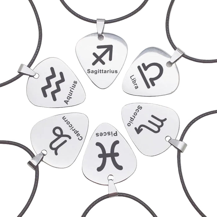 Six silver-tone guitar pick pendants featuring engraved black zodiac symbols for Sagittarius, Libra, Scorpio, Pisces, Capricorn, and Aquarius on adjustable black cords.