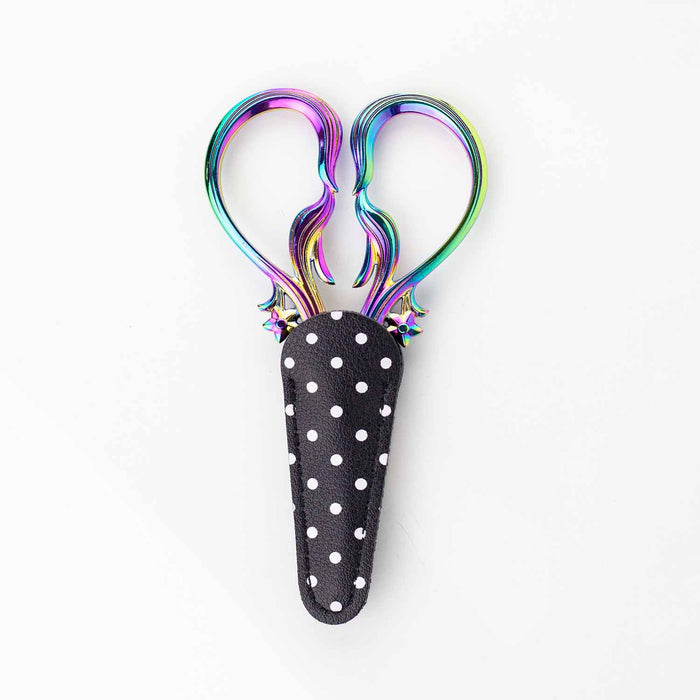 Star Dust Rainbow embroidery scissors tucked into their black and white polka dot leather sheath showing just the iridescent rainbow handles above the sheath