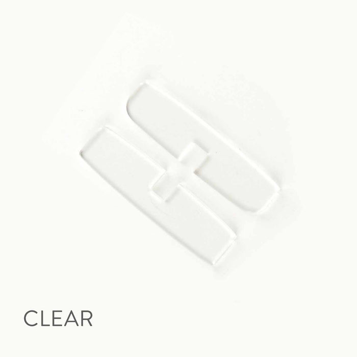 Clear tin divider inside small hinge-style storage tin