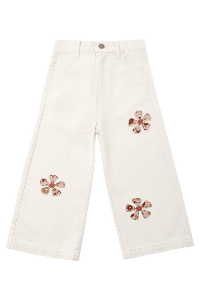 White pants with floral embellishments on a white background