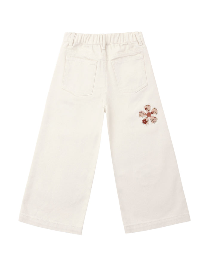 White pants with a floral design on a white background