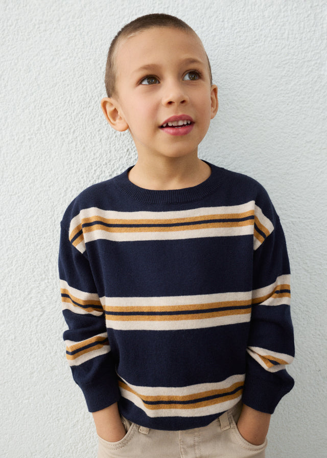 child wearing striped sweater