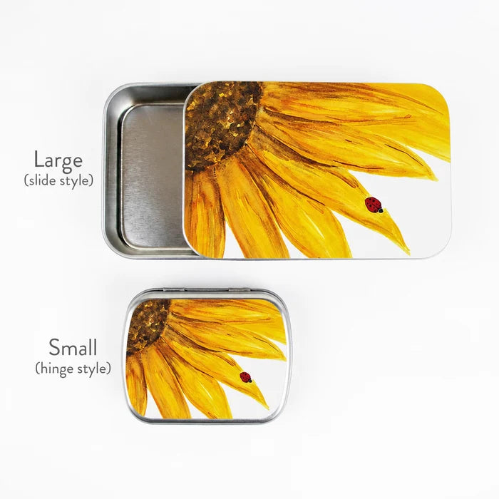 Large and small sunflower stitch marker tins side by side showing size comparison