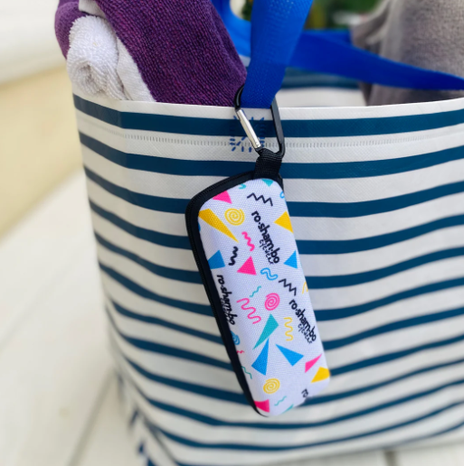 Striped bag with a colorful keychain attached
