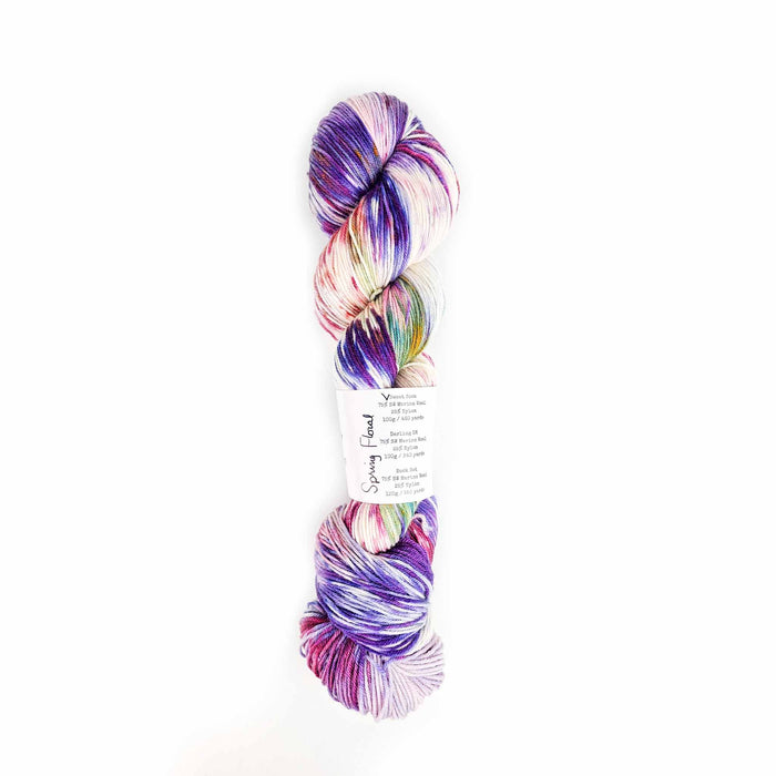 Skein of Sweet Tea Spring Floral yarn showing label with weight options: Sweet Sock, Darling DK, and Sock Set