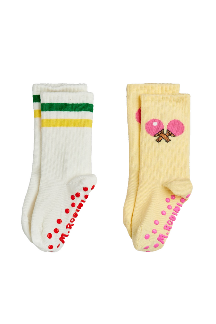 Two pairs of socks with colorful patterns on a white background