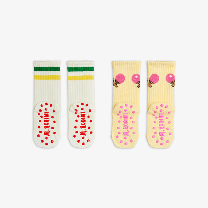 Two pairs of socks with colorful designs on a white background