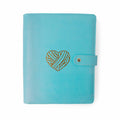 Teal Heart Project Journal Planner front cover in smooth teal faux leather with a gold foil yarn heart design and snap closure
