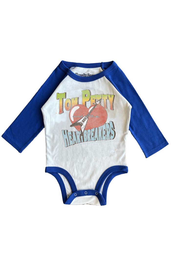 Baby onesie with Tom Petty and the Heartbreakers design on a white background