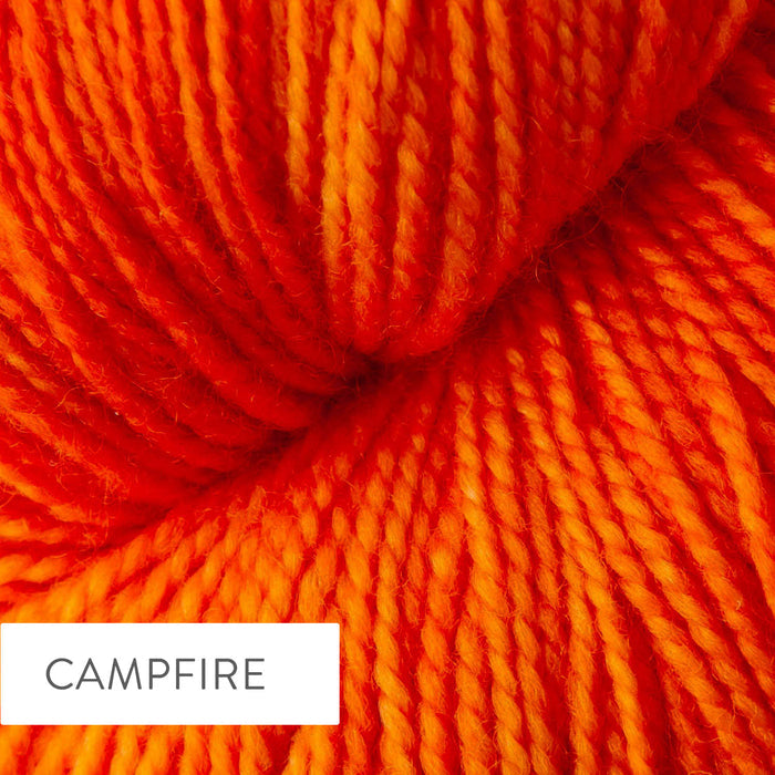 Close-up of TSS Classic Sock yarn in Campfire colorway showing the hand-dyed vibrant orange and red tones
