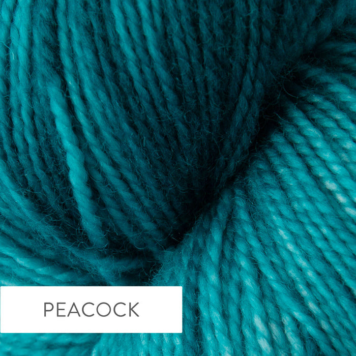 Close-up of TSS Classic Sock yarn in Peacock colorway showing the hand-dyed deep teal and turquoise tones