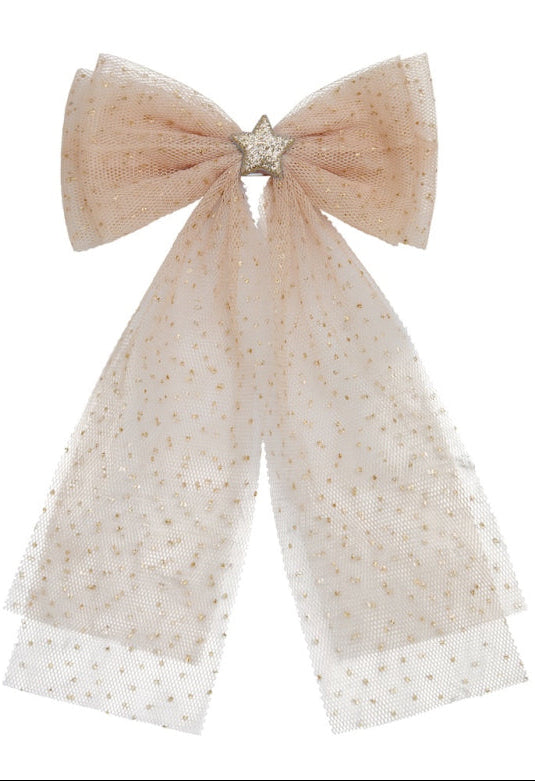 Beige tulle bow with a star-shaped brooch on a white background