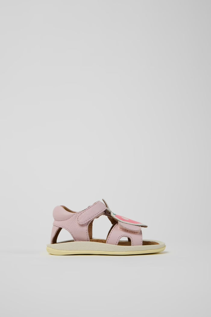 Pink sandal with a strap on a light gray background