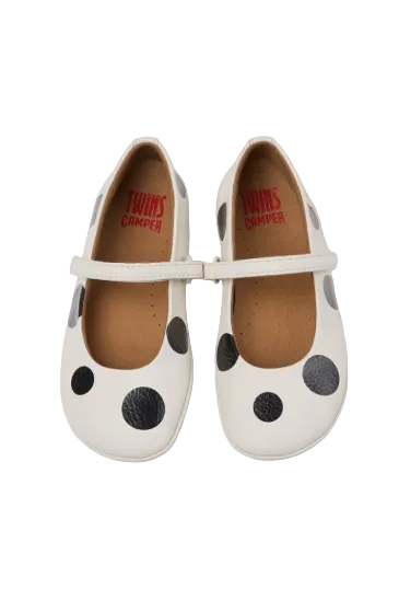 White shoes with black polka dots