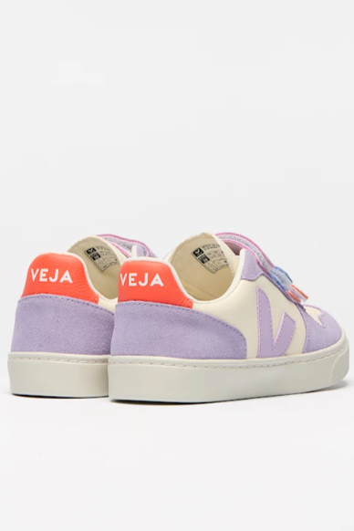Pair of purple and pink Veja sneakers on a white background