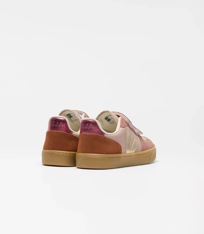 Pair of brown and pink sneakers on a white background