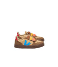 Pair of children's sneakers with colorful accents on a light gray background