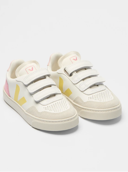 White sneakers with colorful accents on a light gray background