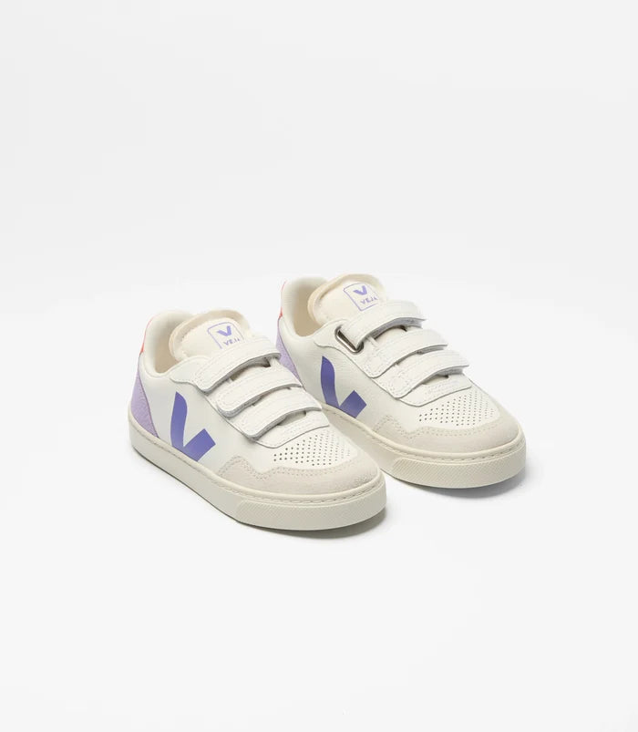 White sneakers with purple logo on a white background