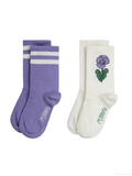 Two pairs of socks on a plain white background: one pair is lavender purple with two white stripes, and the other pair is off-white with a purple flower and green leaf graphic on the front.
