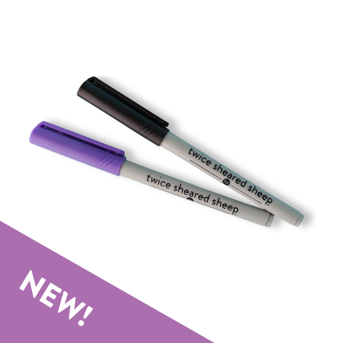 Set of two Twice Sheared Sheep branded wet erase markers with purple and black caps