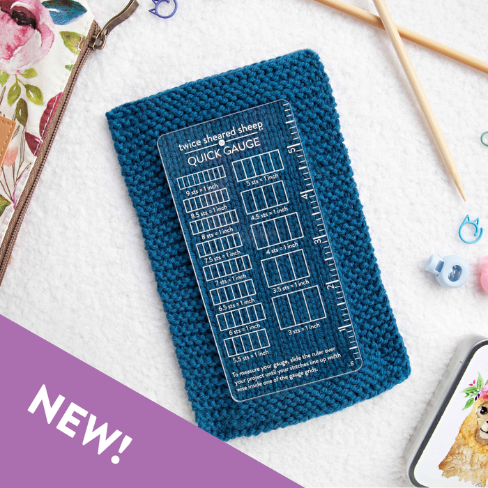 Blue knitted gauge swatch with a clear gauge ruler on a white background