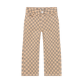 A pair of straight-leg jeans featuring a beige and gray checkerboard pattern, shown flat against a solid white background.