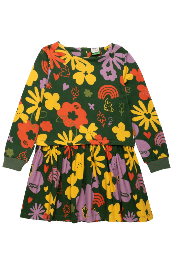 A long-sleeve children's dress with a dark green base and a colorful retro floral print featuring yellow, orange, purple, and red flowers, hearts, and rainbows, shown flat on a white background.